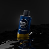 a bottle of nivea men shampoo floating in water